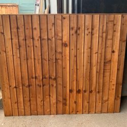 close board fence panels section before installation in a garden
